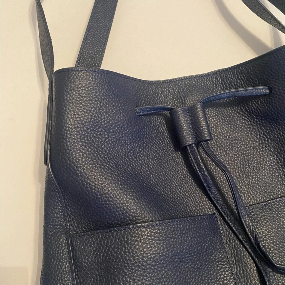 LAGGO || Andrea Tassel Drawstring Hobo Bag Pockets Pebbled Leather Navy‎